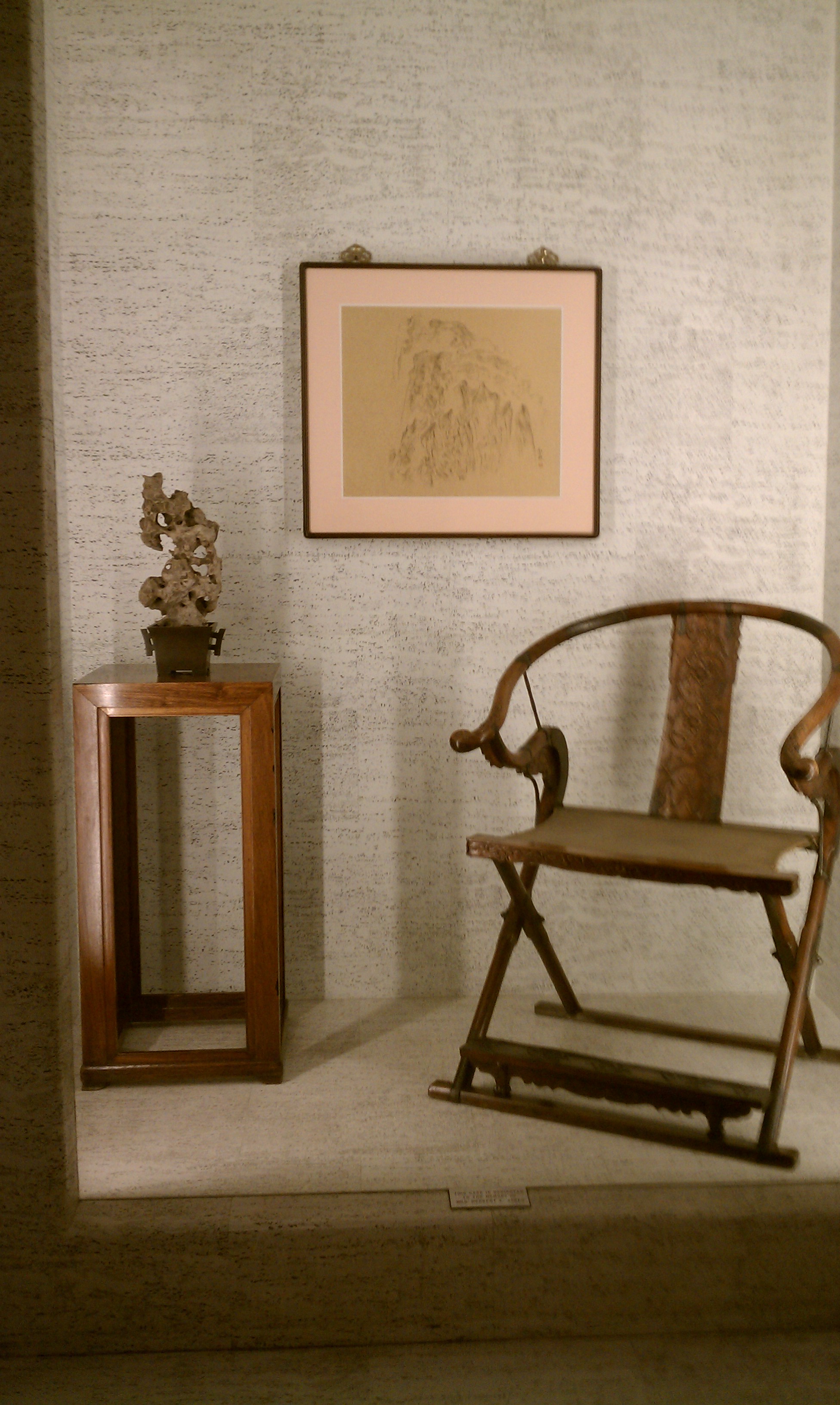 Chinese art: Ancient furniture and modern painting. Note scholar stone on table.