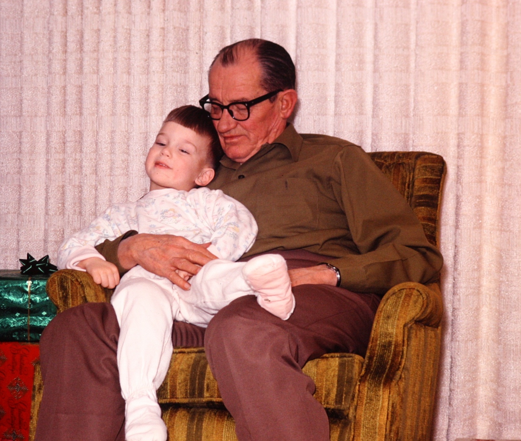 My paternal grandfather and my brother -- note the footie pajamas (though these are pink, so they may be hand-me-downs from my sister)