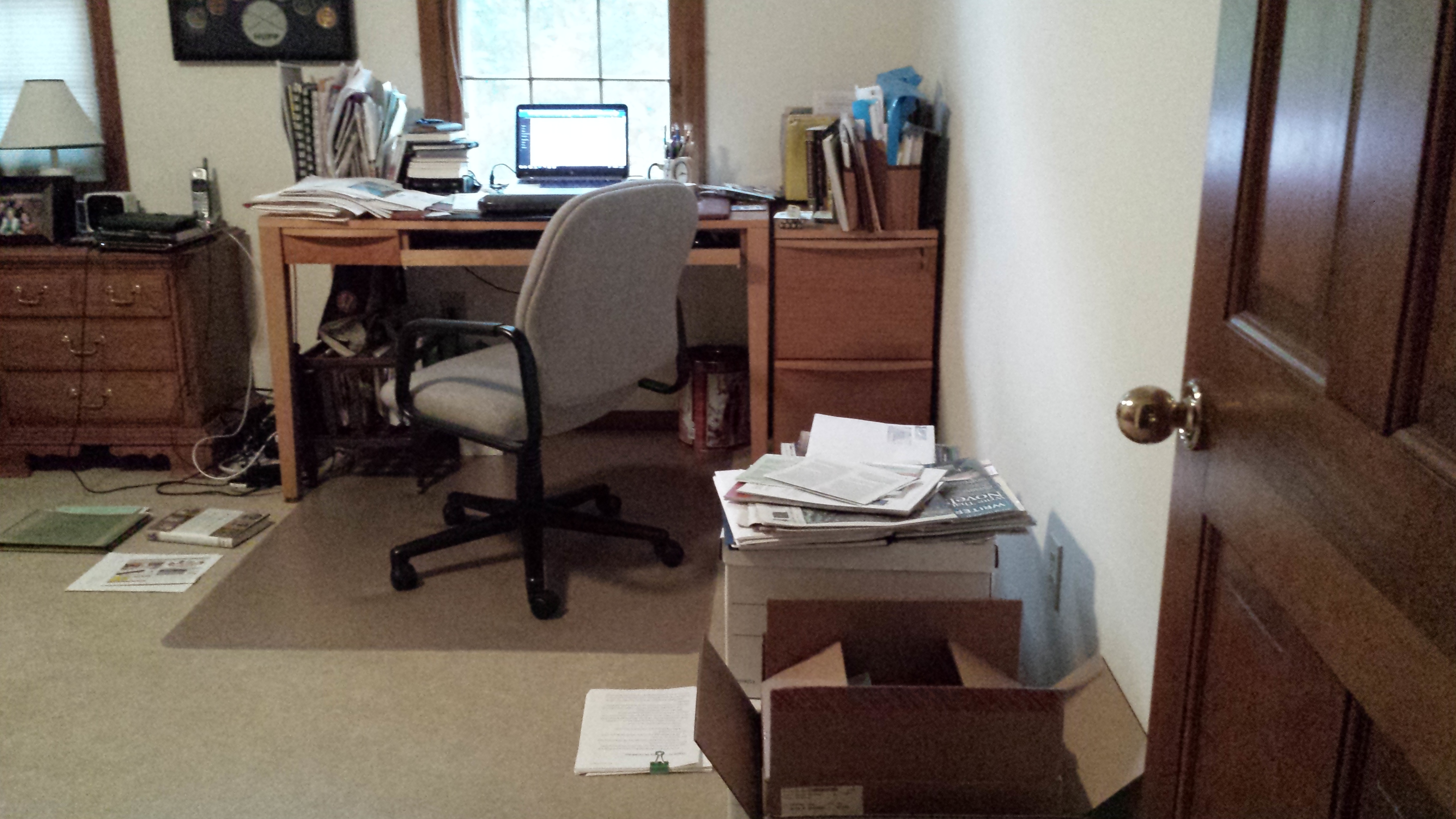 My desk, as I write this post. Note how I file on the floor. It's worked for me for 35 years.