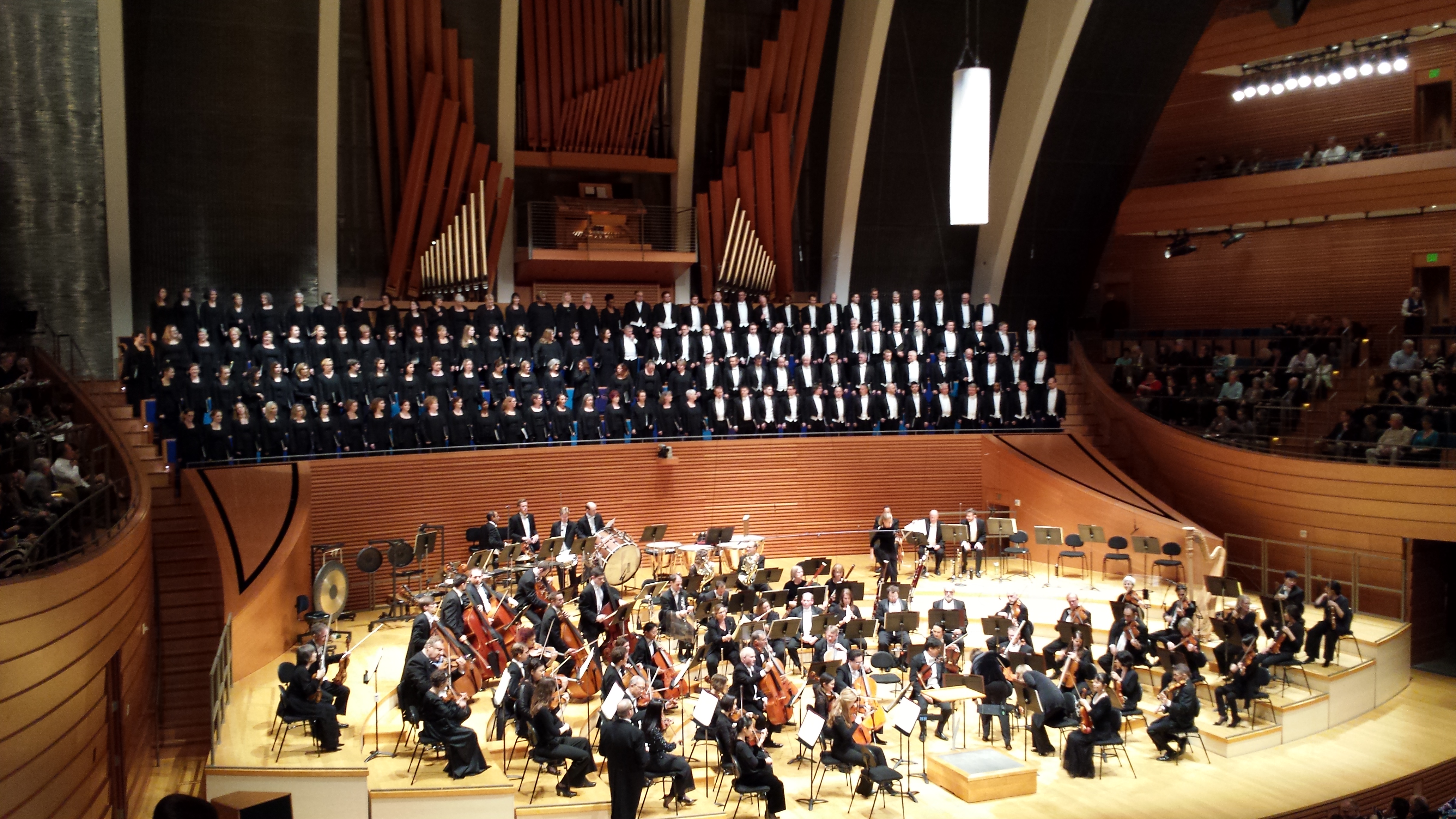 Kansas City Symphony warming up on October 24, 2015, with chorus behind them